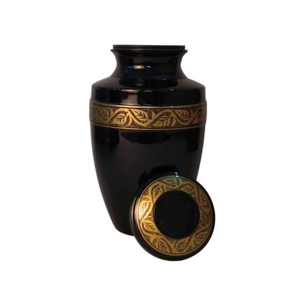 Black decorative urn with gold leaf band and matching lid