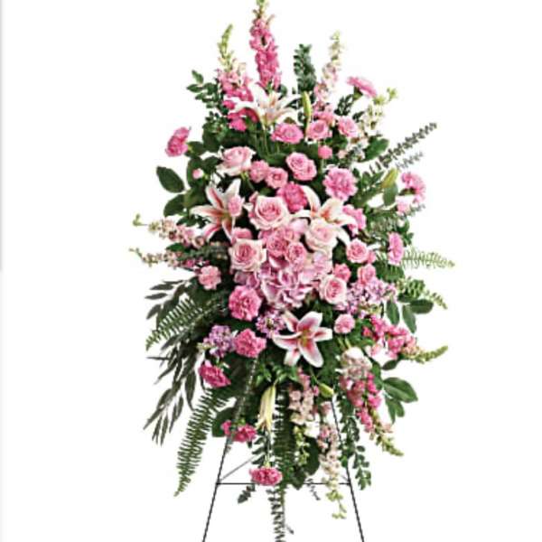 Tall pink floral standing spray on an easel