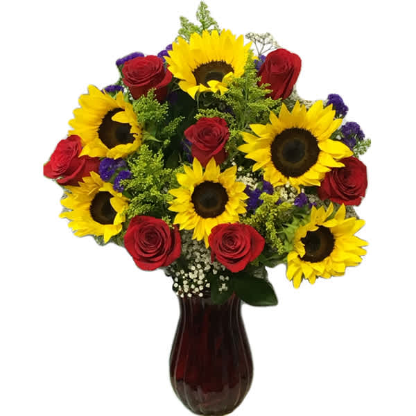 Bouquet of sunflowers and red roses in a dark glass vase