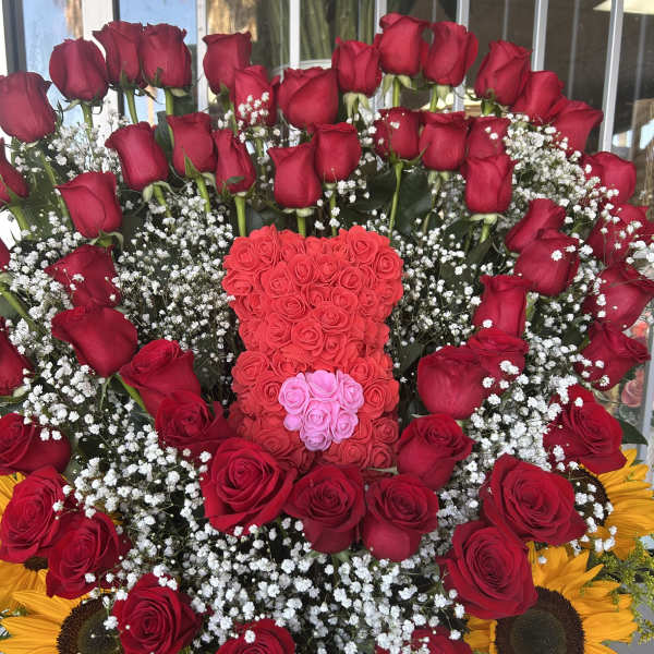 Large bouquet of red roses with baby’s breath and sunflowers