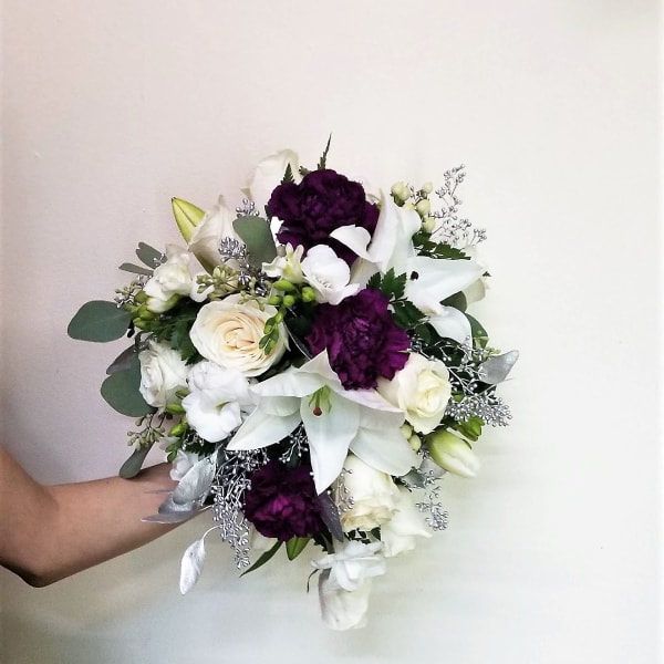 White and purple bouquet with lilies and roses