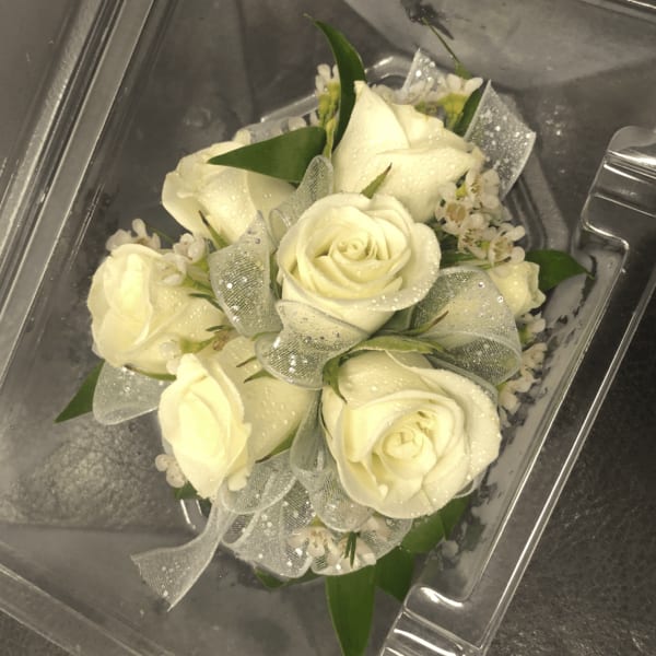 White rose bouquet with sheer ribbon in a clear plastic box