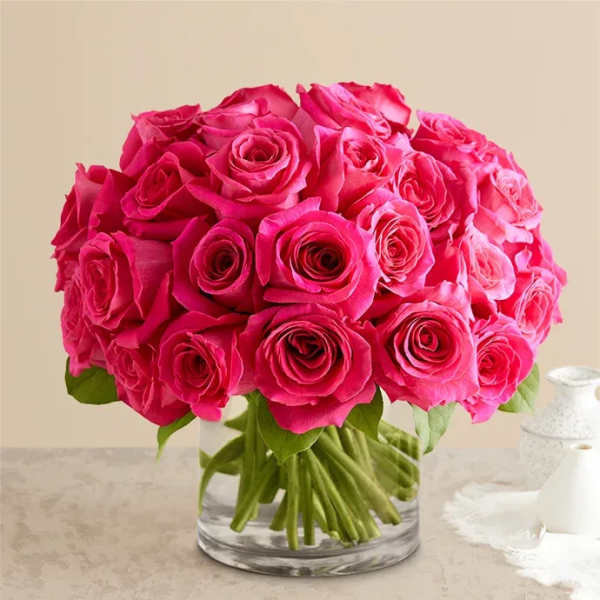 Pink rose bouquet in a clear glass vase