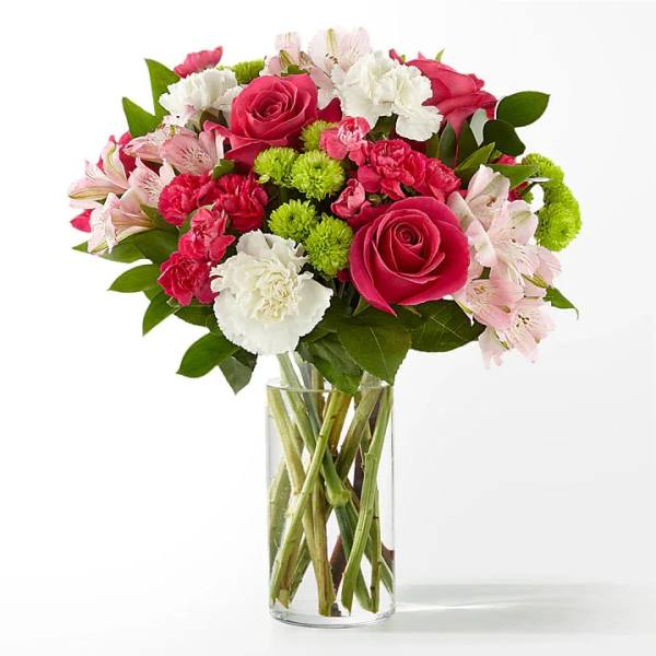 Pink and white mixed bouquet in a clear glass vase