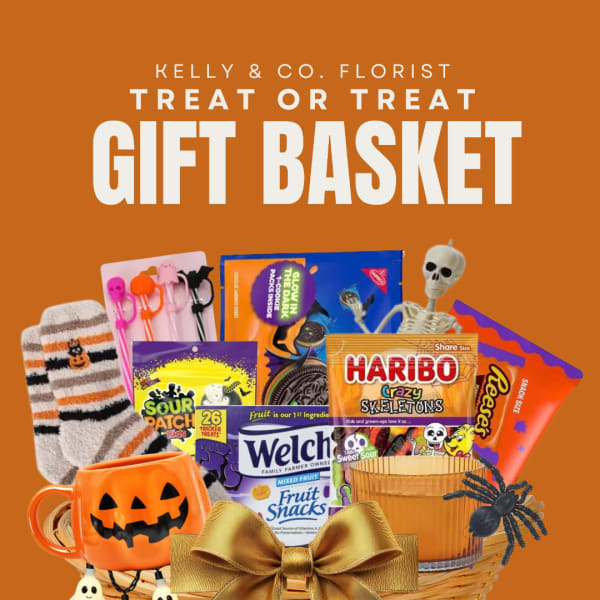 Halloween gift basket with candy, socks, mug, and spooky decorations
