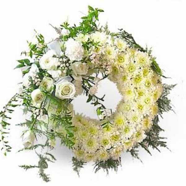 Heart-shaped floral wreath with white and pale yellow flowers