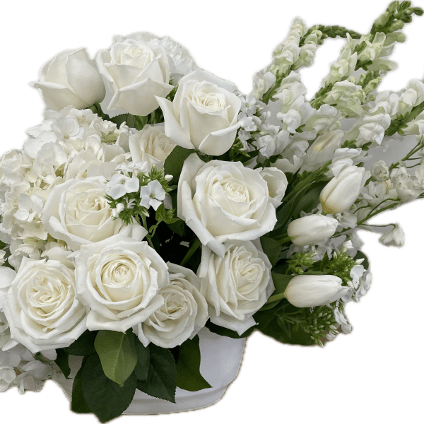 White roses and hydrangeas in a low white container