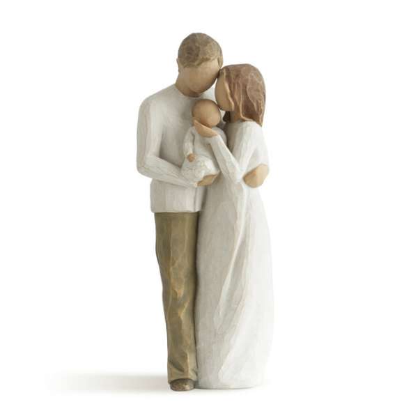 Wooden figurine of a family holding a baby