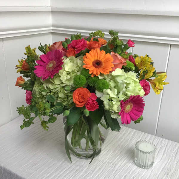 Colorful mixed bouquet in a clear glass vase