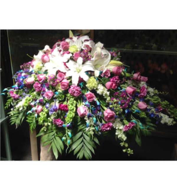 Large floral spray with white lilies and pink roses