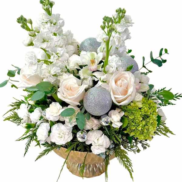 White floral arrangement with roses, orchids, and silver ornaments in a vase