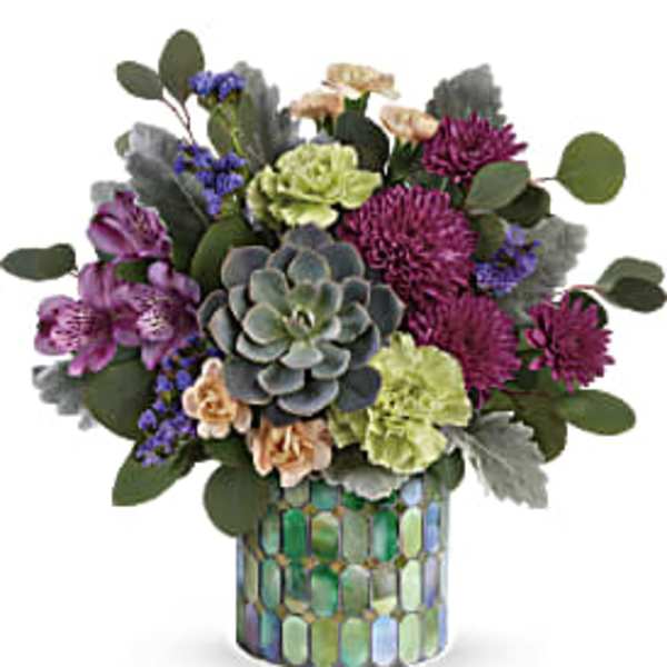 Mixed bouquet with succulents and purple flowers in a mosaic vase