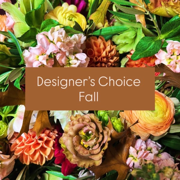 Fall floral arrangement with mixed blooms and a designer's choice sign
