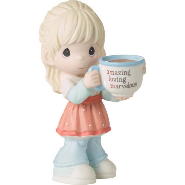 Figurine of a girl holding a mug with text