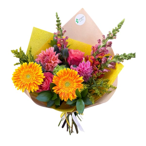 Bouquet of orange gerbera daisies, pink roses, and purple blooms in yellow wrap