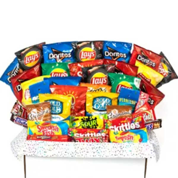 Assorted snack bags arranged like a bouquet on a bench