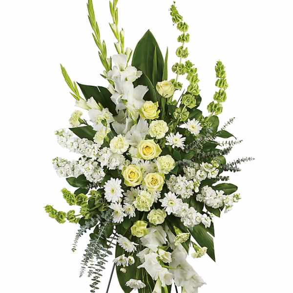 White and pale yellow floral standing spray on an easel