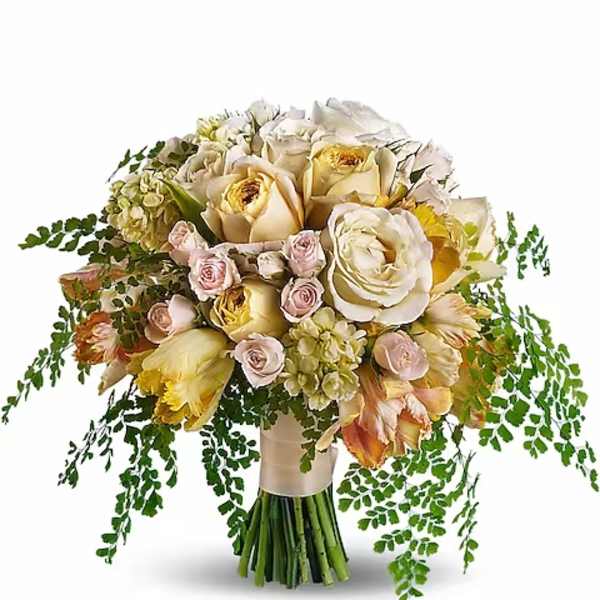 Bouquet of cream and blush roses with trailing greenery