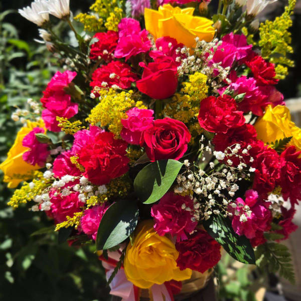Bright mixed bouquet with red, pink, and yellow flowers
