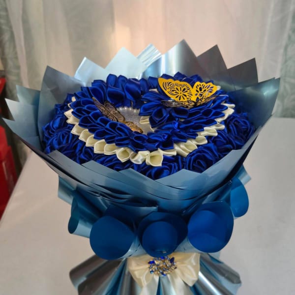 Blue and white satin ribbon bouquet with butterfly accents