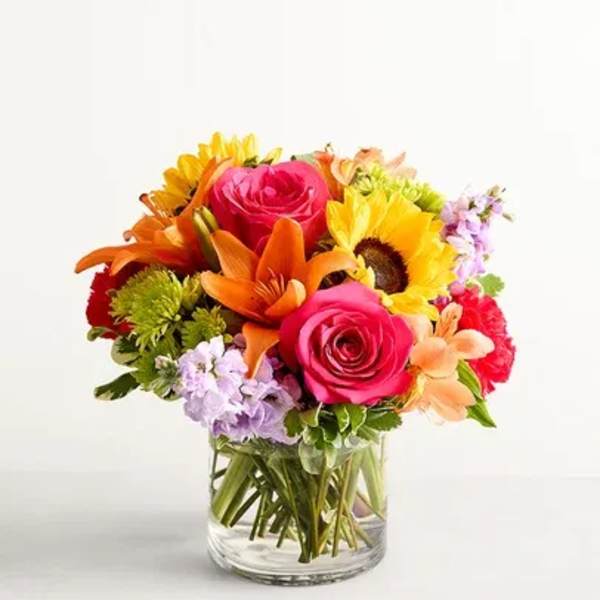 Colorful mixed bouquet in a clear glass vase