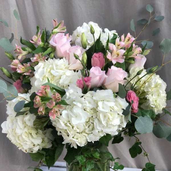 Pink and white bouquet in a glass vase