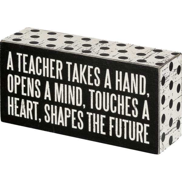 Decorative block with teacher quote in black and white