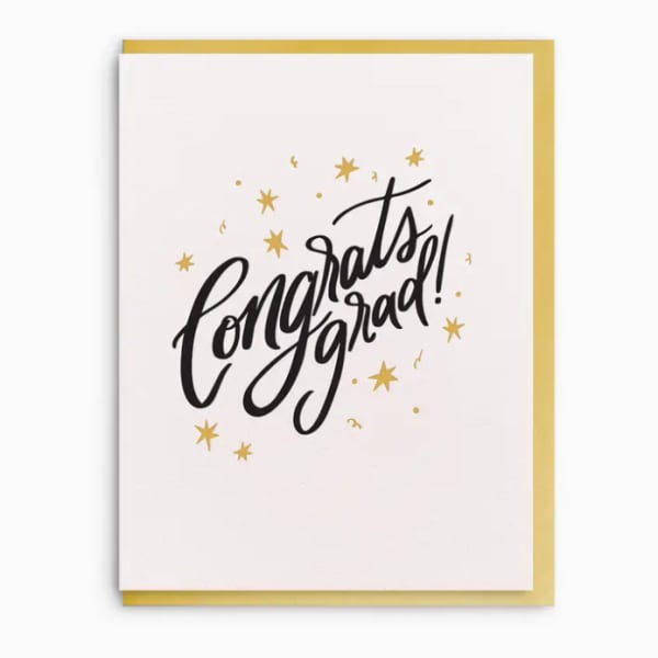 Greeting card with "congrats grad" text and gold stars