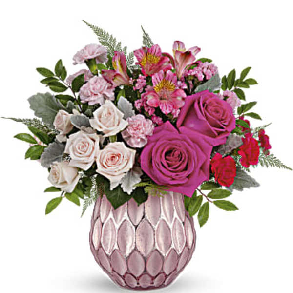Pink and white mixed bouquet in a textured pink vase