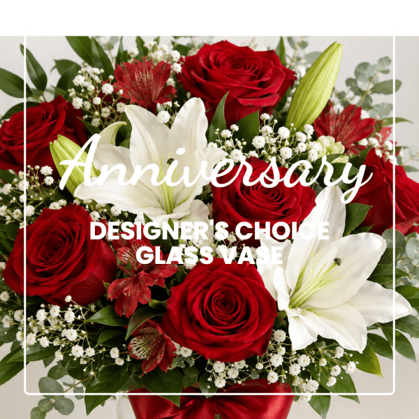 Red roses and white lilies in a glass vase with anniversary text overlay