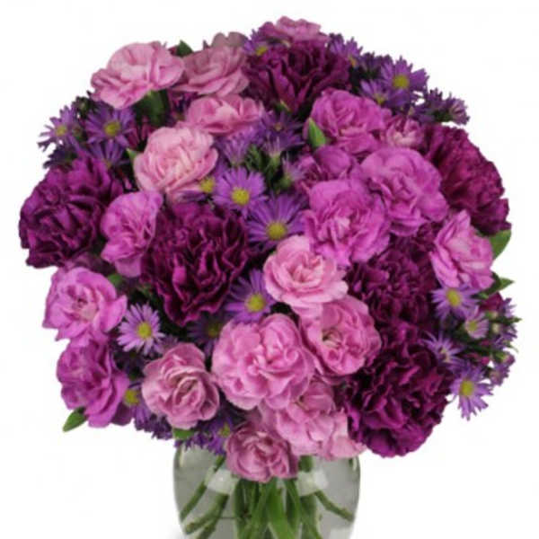 Pink and purple bouquet in a clear glass vase