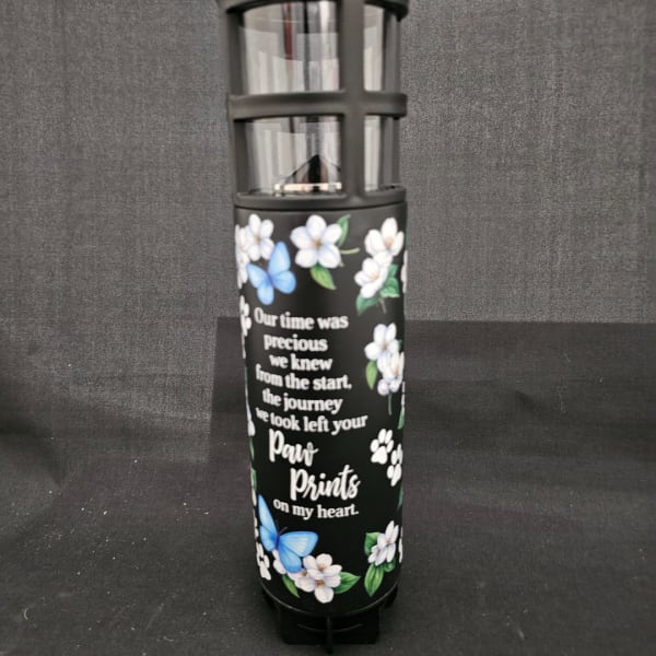 Black memorial lantern with floral and butterfly print and a remembrance message