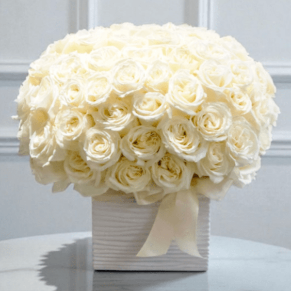 White rose bouquet in a ribbed square box with a ribbon