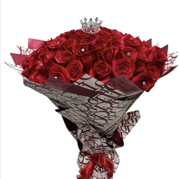 Bouquet of red roses with a small crown topper