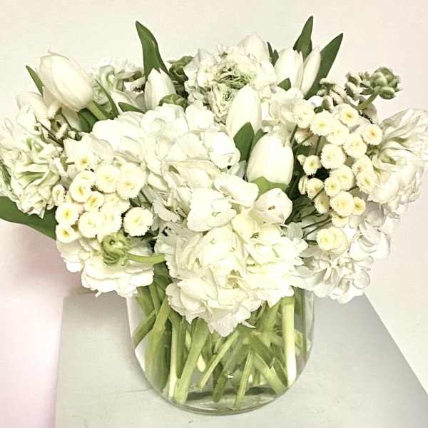 White floral bouquet in a clear glass vase