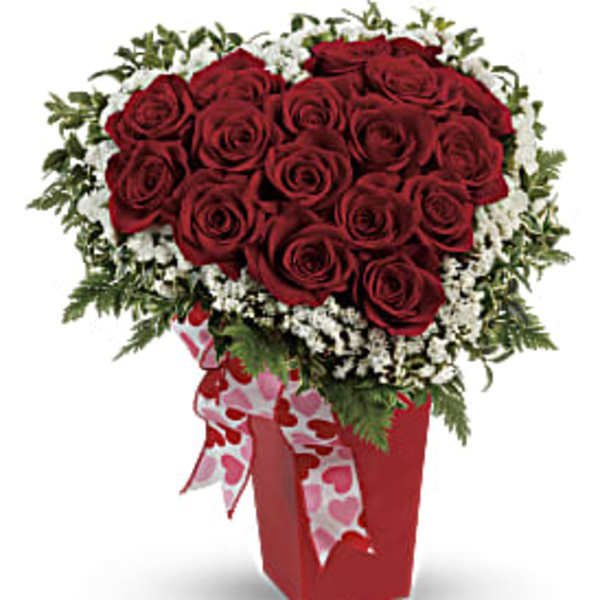 Red rose bouquet in a red box with a heart ribbon