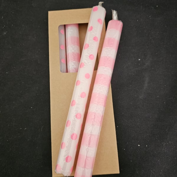 Pink polka dot and striped candles in a cardboard package