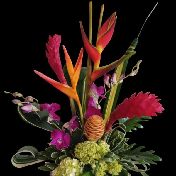 Tropical flower arrangement with orchids and bird-of-paradise in a decorative vase