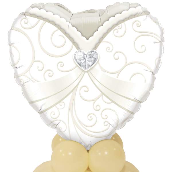 White heart-shaped balloon with gold swirls on a cluster of pale yellow balloons