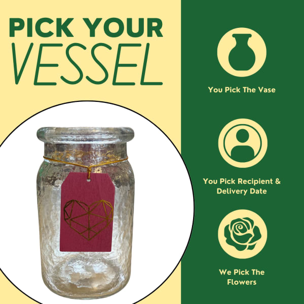 Glass vase with a pink tag and green text on a split yellow and green background