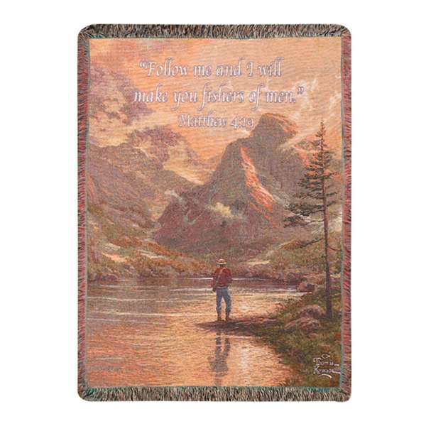 Woven blanket with a mountain scene and Bible verse text