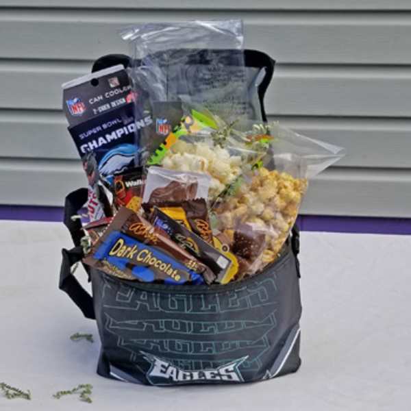 Gift basket with snacks and candy in an Eagles tote bag
