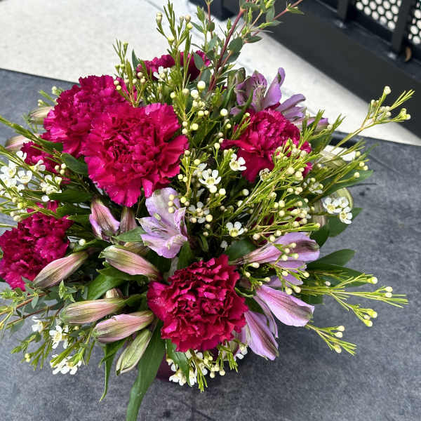 Bouquet of hot pink carnations and lavender alstroemeria