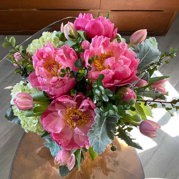 Pink peony bouquet with tulips and pale green hydrangea