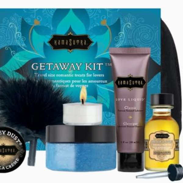 Travel gift kit with lotion, candle, scrub, oil, and a feather accessory