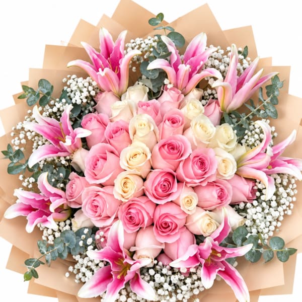 Bouquet of pink roses and pink lilies with white filler flowers