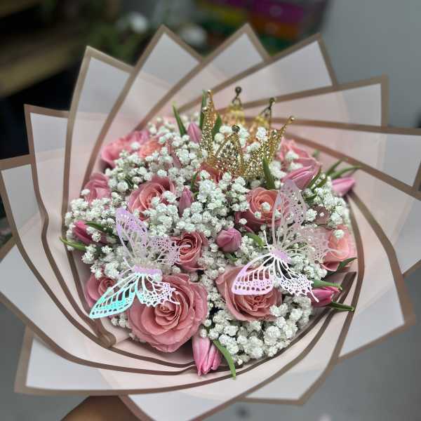 Pink rose bouquet with baby’s breath, butterflies, and gold crown picks
