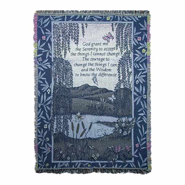 Blue woven blanket with a landscape scene and Serenity Prayer text