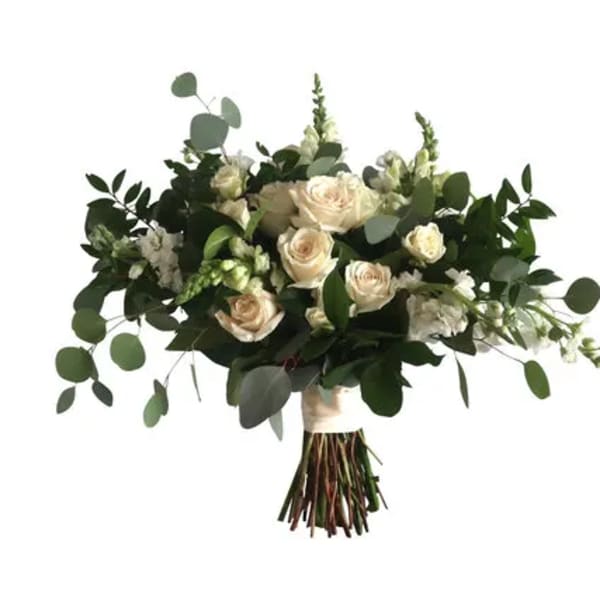 Bouquet of white roses and greenery tied at the stems