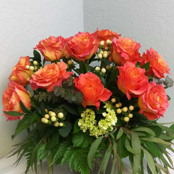 Dozen lush orange roses